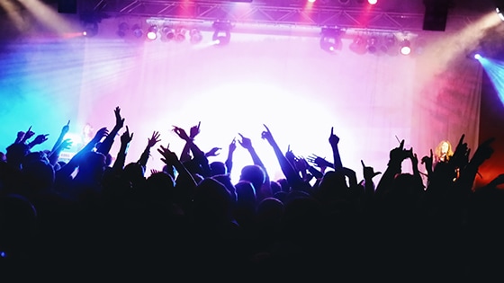 Photo of a crowd in front of a stage